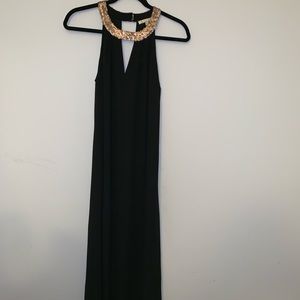 Long (floor-length) black dress with sequins